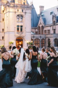 Biltmore Weddings – Marcos and Gaby Bride walks with bridesmaids in emerald green dresses at Biltmore Estate wedding.