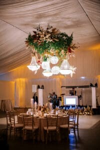 Biltmore Weddings – Marcos and Gaby Elegant wedding reception setup with chandeliers and floral ceiling at Biltmore Estate.