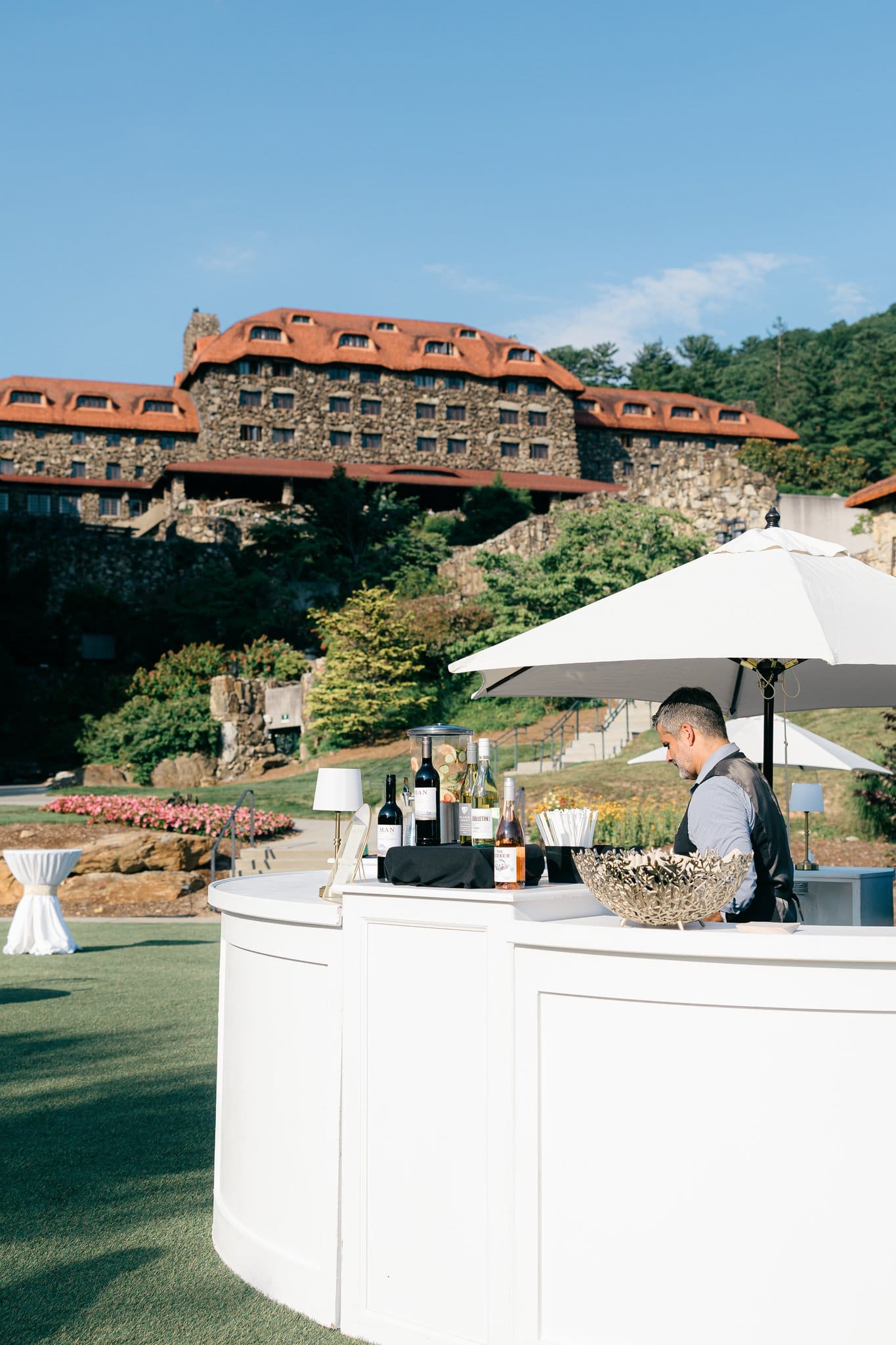 Outdoor bar setup with bartender in front of the Omni Grove Park Inn.