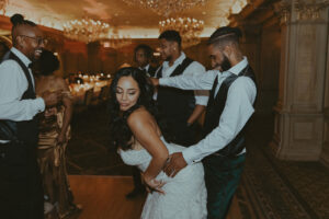 Daniela and Angelo Wedding Grand Bohemian Asheville Close-up of bride and groom enthusiastically dancing together. Wedding Planned by Terran Ward at The Grand Bohemian Asheville