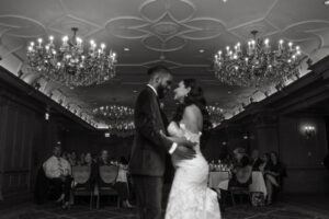 Daniela and Angelo Wedding Grand Bohemian Asheville Blurry black and white photo of bride and groom sharing their first dance. Wedding Planned by Terran Ward at The Grand Bohemian Asheville