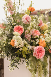 Omni Grove Park Inn Weddings – Mr. and Mrs. Kelly Close-up of colorful wedding flower arrangement with pink, orange, and white blooms