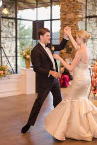 Omni Grove Park Inn Weddings – Mr. and Mrs. Kelly Groom twirls bride during their first dance at the Omni Grove Park Inn.