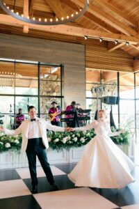 Omni Grove Park Inn Asheville Wedding_Ryan and Lauren Bride and groom share their first dance under chandeliers at the Omni Grove Park Inn. Wedding planned by Asheville wedding planner Terran Ward — bold editorial mountain wedding design.