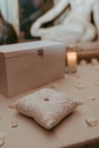 Daniela and Angelo Wedding Grand Bohemian Asheville Close-up of a ring on a pillow. Wedding Planned by Terran Ward at The Grand Bohemian Asheville