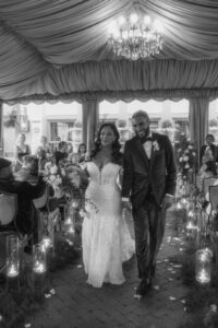 Daniela and Angelo Wedding Grand Bohemian Asheville Black and white photo of the bride and groom walking down the aisle after the ceremony. Wedding Planned by Terran Ward at The Grand Bohemian Asheville